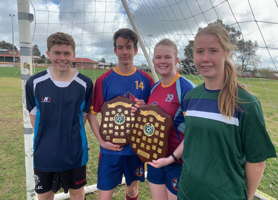 FINALS TIME: Wagga High's Kein Crevatin, Mater Dei's Patrick Mason and Mackenzie Gough and The Riverina Anglican College's Zoe Jenkins with the Creed and Shipard Shields before Wednesday's finals at Gissing Oval. 