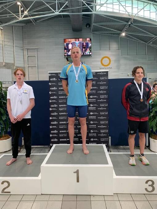 VICTORIOUS: Wagga swimmer Jamie Mooney on the top of the podium after winning the 400m individual medley at the state titles in Sydney. 