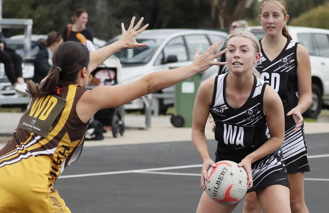 INTENT: TRYC's Sophie Coates looks to pass during Saturday's loss to East Wagga Kooringal. Picture: Les Smith