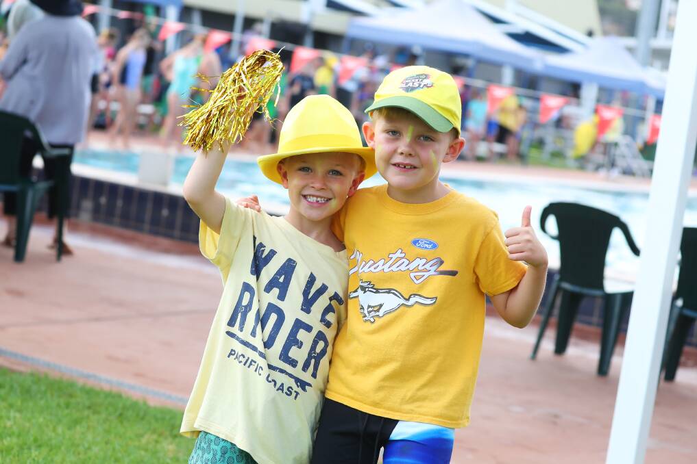 TEAM SPIRIT: Finn Hawkins, seven and Monty Skellern, seven were among the cheer squad at Tuesday's Mater Dei Primary School swimming carnival. Picture: Emma Hillier