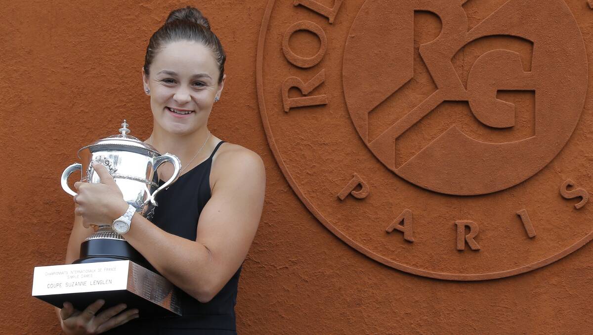 OUR CHAMPION: French Open champion Ashleigh Barty poses with the trophy after her victory over Czech Marketa Vondrousova . Picture: AP Photo/Michel Euler.