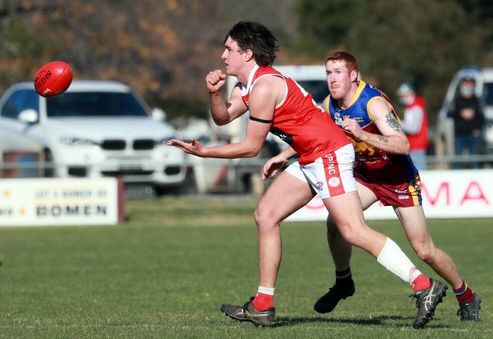 FINALS CHARGE: Collingullie-Glenfield Park's Jack Thompson-Gardener gets a handball away against GGGM last week. Picture: Les Smith