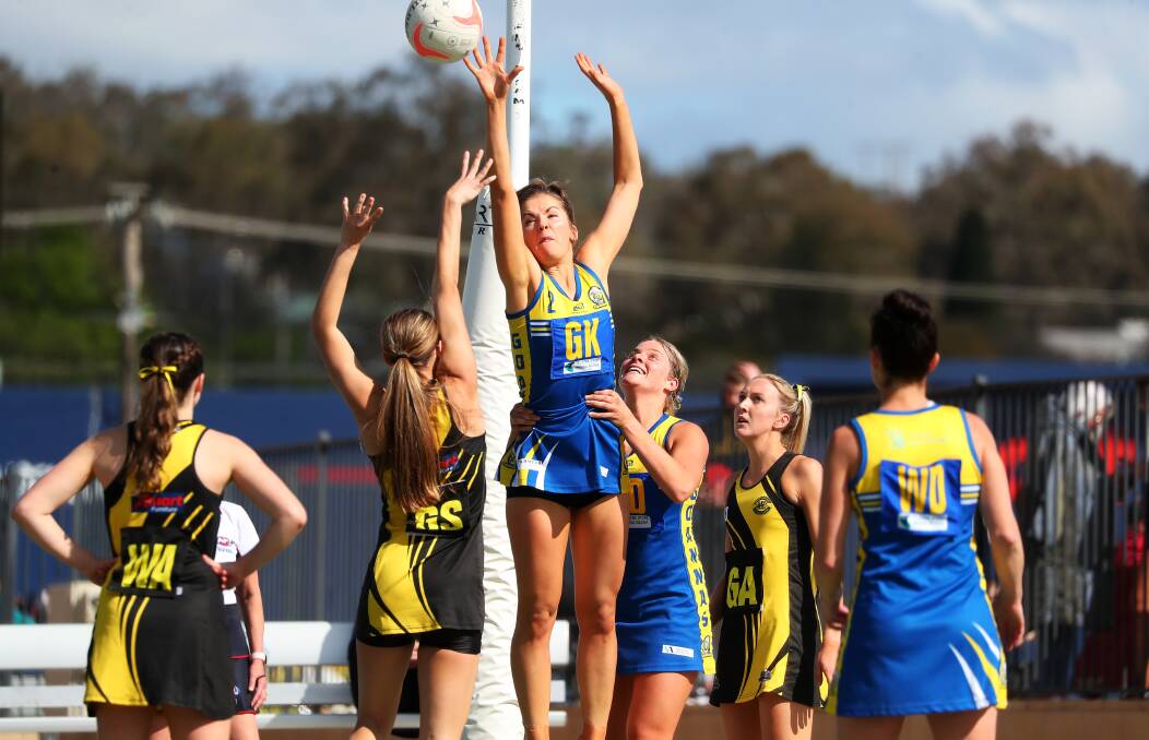 INTENSE BATTLE: MCUE's Shannan Russell looks to block a shot from Wagga Tigers Leila Wadley during the Goanna's one-goal major semi win. Picture: Emma Hillier