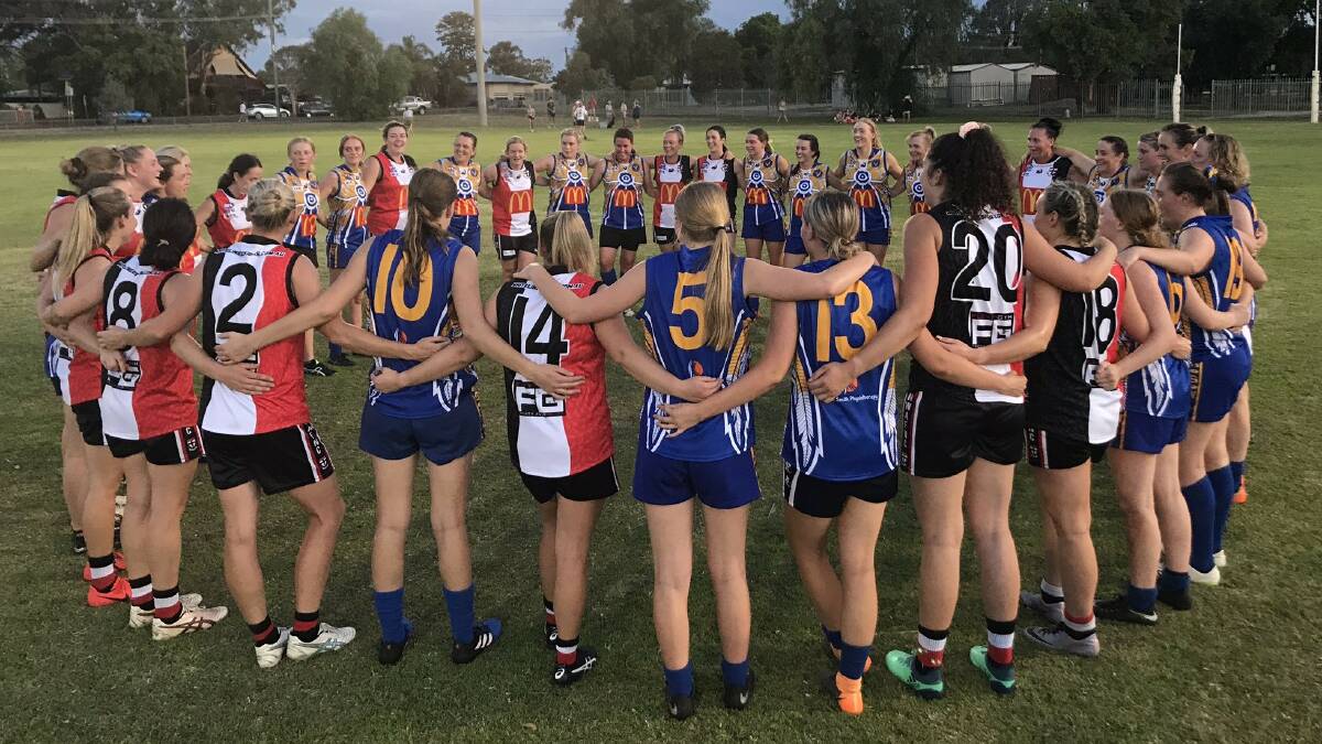 NEW DAWN: North Wagga and Narrandera women's players unite after the Saints won the battle of the new teams on Friday night. Picture: AFL Riverina