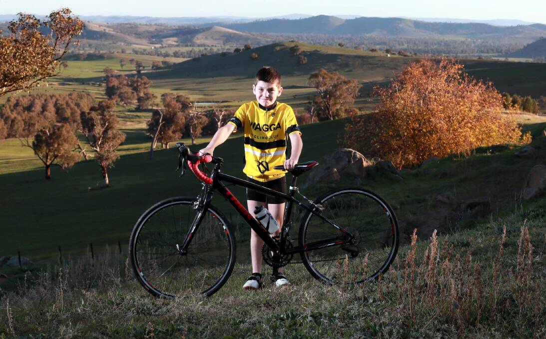 MISSION ACCOMPLISHED: Wagga Cycling Club's Jonah Tonkin atop the 'widow maker' near Wantabadgery. Picture: Les Smith