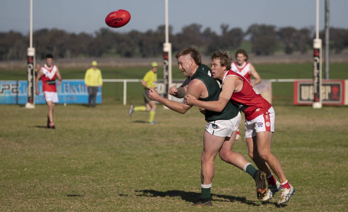 FIERCE CONTEST: Collingullie-Glenfield Park's Matt Klemke tackles Coolamon's Will McGowan during Saturday's draw at Crossroads Oval. Picture: Madeline Begley 