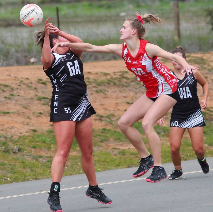 TOUGH DEFENCE: CSU skipper Ashleigh O'Leary bats a ball away from The Rock-Yerong Creek's Lily Wild during an early season match this year. Picture: Emma Hillier
