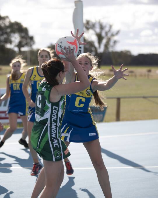 INTENSE: MCUE's Phoebe Wallace defends Coolamon's Kirralee Gerhard on Saturday. Picture: Madeline Begley