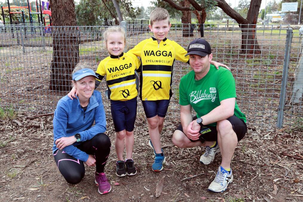 ALL SMILES: Young Wagga cyclists Chloe and Jacob McLachlan with parents Renee and Garth. Picture: Les Smith