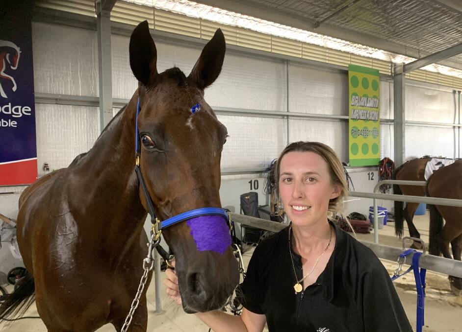 BACK ON TRACK: Leeton trainer-driver Alanah Pitt with horse Soho Beijing after a race at Wagga on Monday. Picture: Jon Tuxworth