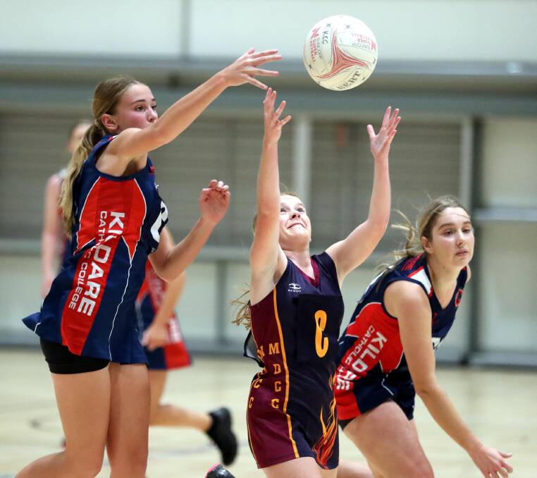 TOUGH CLASH: Kildare's Phoebe Wallace and Flynn Hogg contest the ball against Mater Dei's Gabby O'Connell.