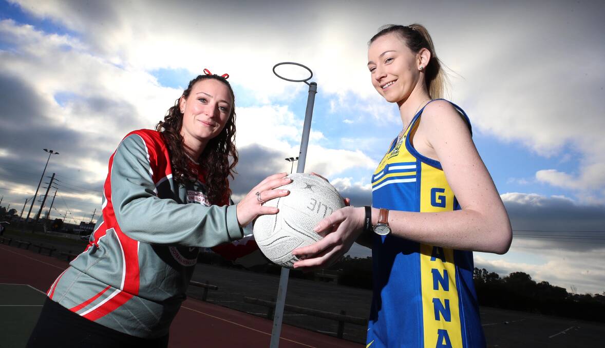 FRIENDLY RIVALRY: Demons defender Jemima Norbury with Goannas shooter and former Collingullie-Glenfield Park teammate Katie Caller earlier this year. Picture: Les Smith