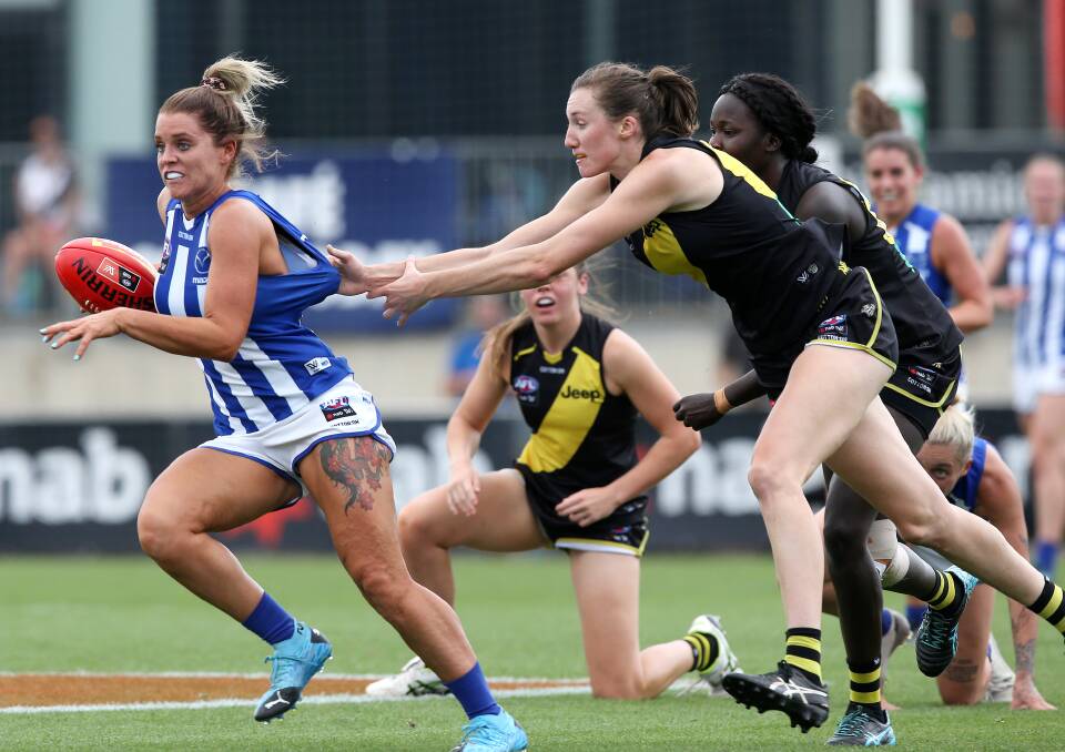 BIG TIME: Wagga product Rebecca Miller lays a tackle during an AFLW game against North Melbourne earlier this season. Picture: Richmond FC 