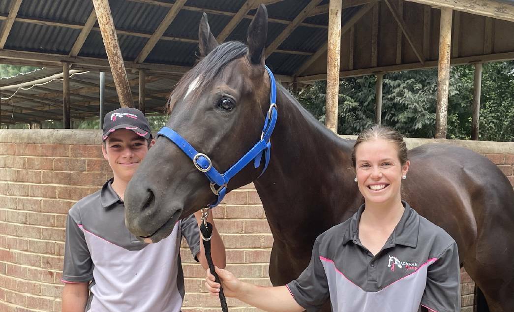 HE'S BACK: Rocket Tiger with strappers Oliver Spackman and Emily Waters before he returned to racing at Flemington on Saturday. Picture: Jon Tuxworth