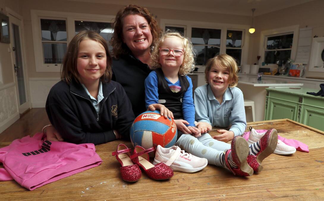 Pictured with her mum Katherine and sisters Billie, 11 and Maggie, 7. Picture: Les Smith