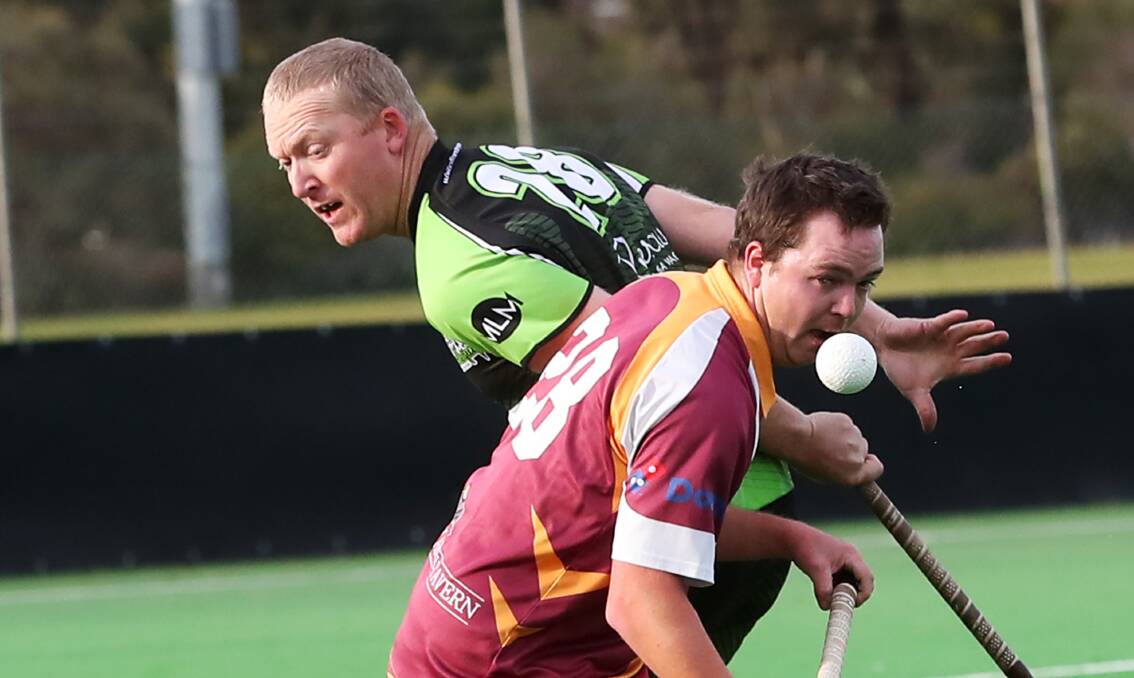 FOCUSED: Craig Watson and Nick Murray keep their eye on the ball during their Super Nines clash. Picture: Emma Hillier