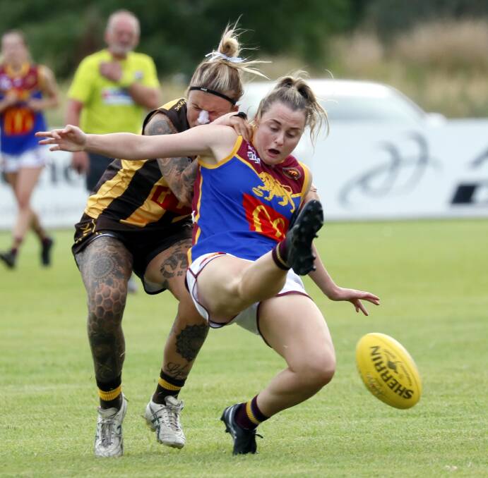 TOUGH GRIND: Lucy Anderson, who kicked both Ganmain-Grong Grong-Matong's goals in Friday's win over East Wagga Kooringal, is tackled by Kate Opolski. Picture: Les Smith 