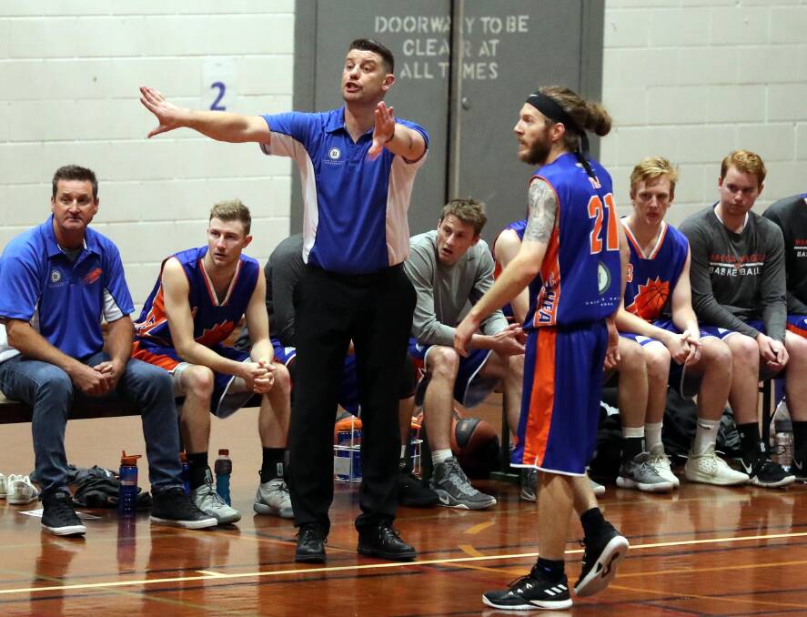 HANDS ON COACH: Wagga Heat coach Matt Bishop delivers some instructions from the sideline during a home game this season. 