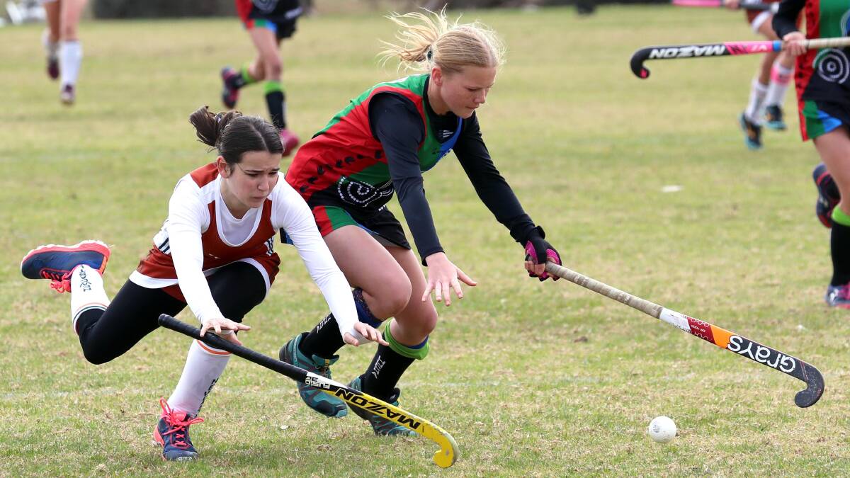 YOUNG TALENT: Newcastle's Ella Grgas and Wagga's Bethany Macarthur compete for the ball during their under-15 state championships clash at Jubilee Park. Picture: Les Smith.
