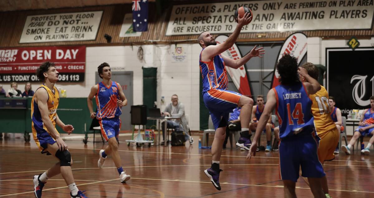 EXPERIENCE: Wagga Heat big man Scott Hare drives to the basket during Saturday's home clash with Canberra Gunners Academy. Picture: Madeline Begley 
