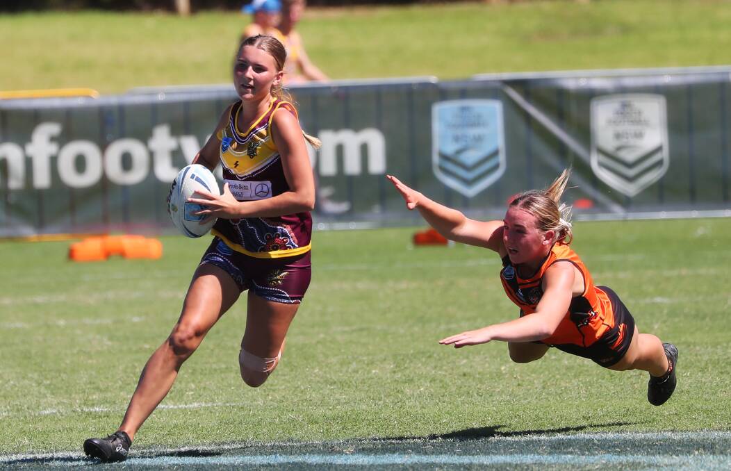 A Hills Hornets player evades an Orange rival during the under-18 grand final. Picture: Emma Hillier