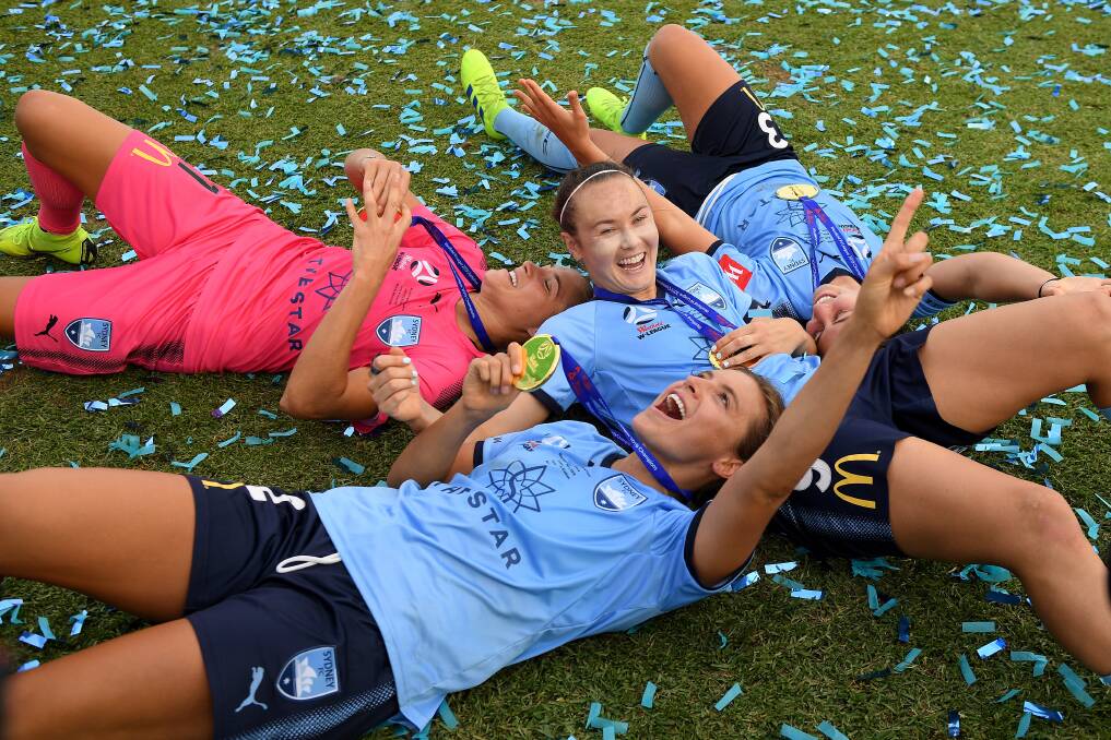 WINNING FEELING: Sydney FC players celebrate their W-League grand final win over Perth in February. Picture: AAP Image/Dan Himbrechts.
