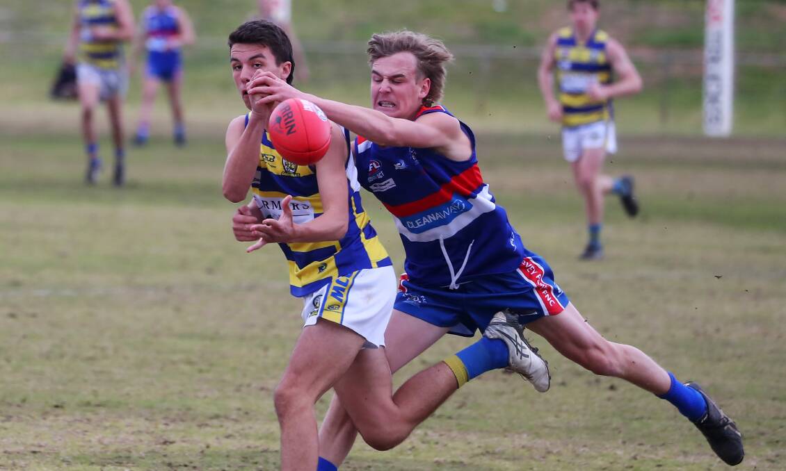 SEASON DONE: Mangoplah-Cookardinia United-Eastlakes' Flynn Collins and Turvey Park's Tate Isaac do battle earlier this year. Picture: Emma Hillier
