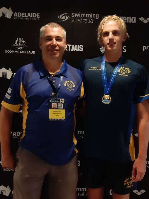 WINNER: Jamie Mooney, pictured with coach Gennadiy Labara, won gold in 100m freestyle at the Australian Age Championships. 