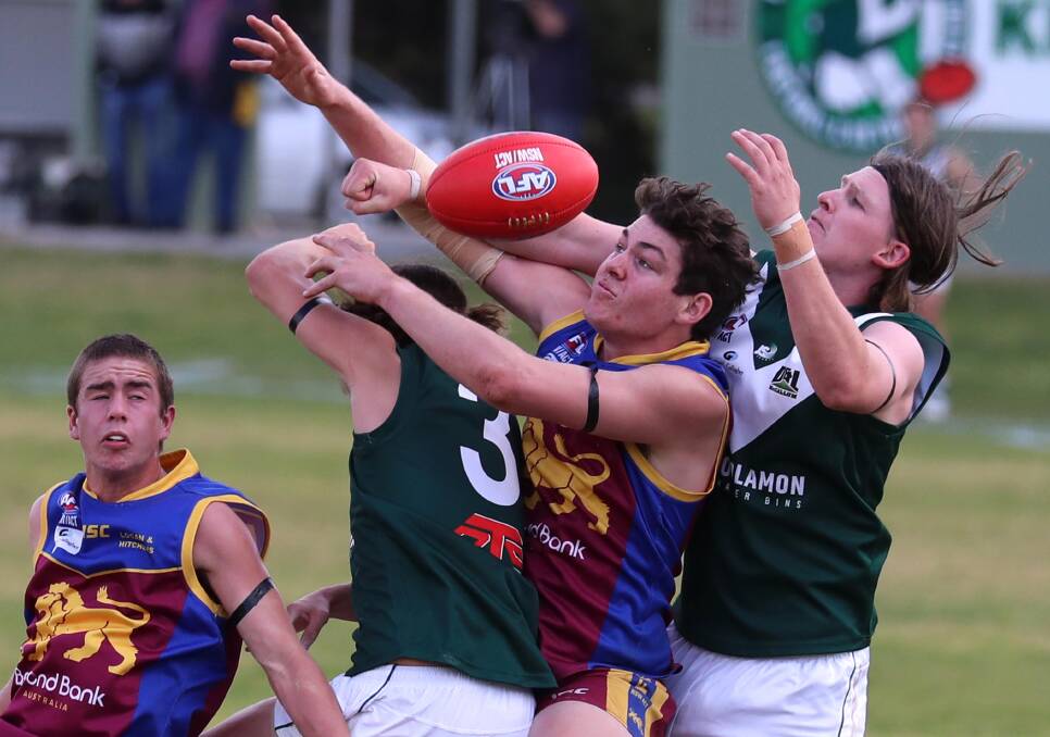 CANBERRA CONNECTION: Riley Corbett (second from right) hopes the Canberra Demons will continue in the new second tier competition. Picture: Les Smith