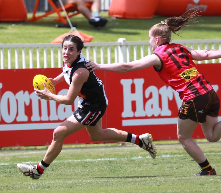 LOOMING SEASON: North Wagga's Megan Porter tries to evade East Wagga-Kooringal's Keely Bloomfield during a game last season. Picture: Les Smith