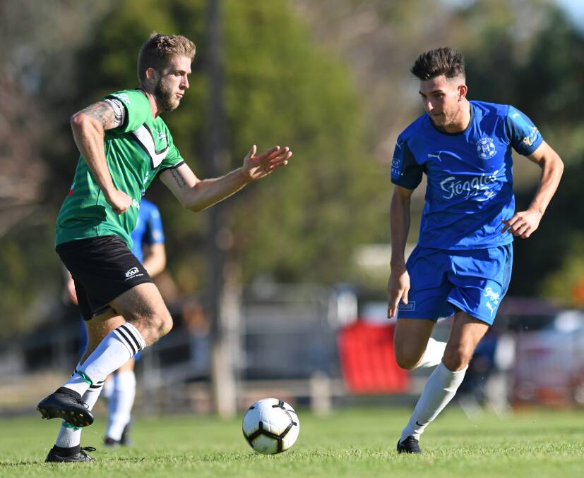 GOAL SCORER: Hanwood's Michael Cimador (right, taking on South Wagga's Andrew Hull in round one) scored the decisive goal against Henwood Park on Saturday. 