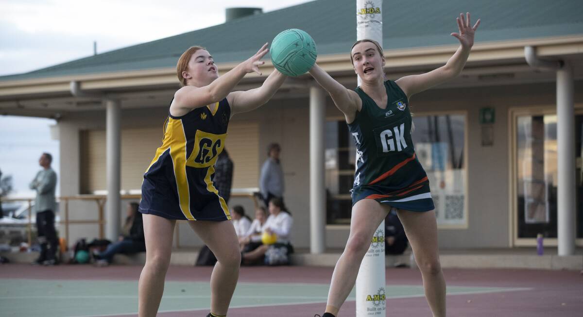 TRAC captain Sarah Croker battles with Kooringal High's Maddie Priest during the preliminary rounds. Picture: Madeline Begley