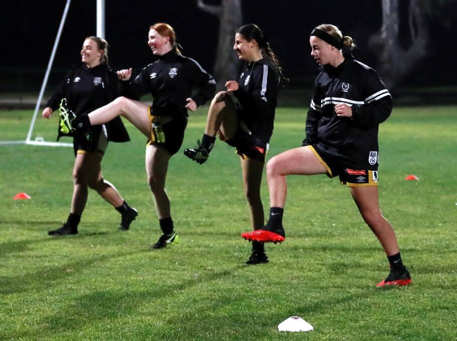 HAPPY TO BE BACK: Wagga City players warm up before training. Picture: Les Smith