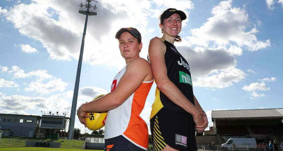 BIG BOOST: Richmond's Rebecca Miller, pictured with Giants star Alyce Parker before an AFLW clash in Wagga in 2020, has lauded the new CBA deal. Picture: Les Smith