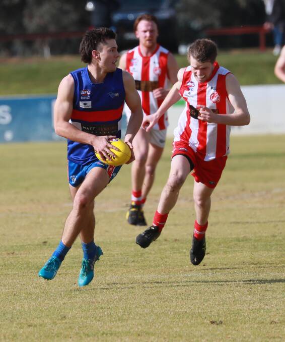 NO FOOTY: Charles Sturt University's Brendan Havercroft tries to chase down Turvey Park's Lachie Leary in Saturday's trial match. Picture: Les Smith