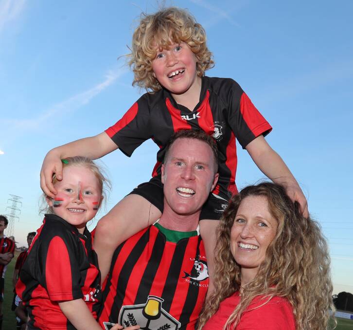 HAPPY TIMES: Duncan Brodie with wife Jess and children Finn and Maddison after Lake Albert's grand final win over Young last year. Picture: Les Smith