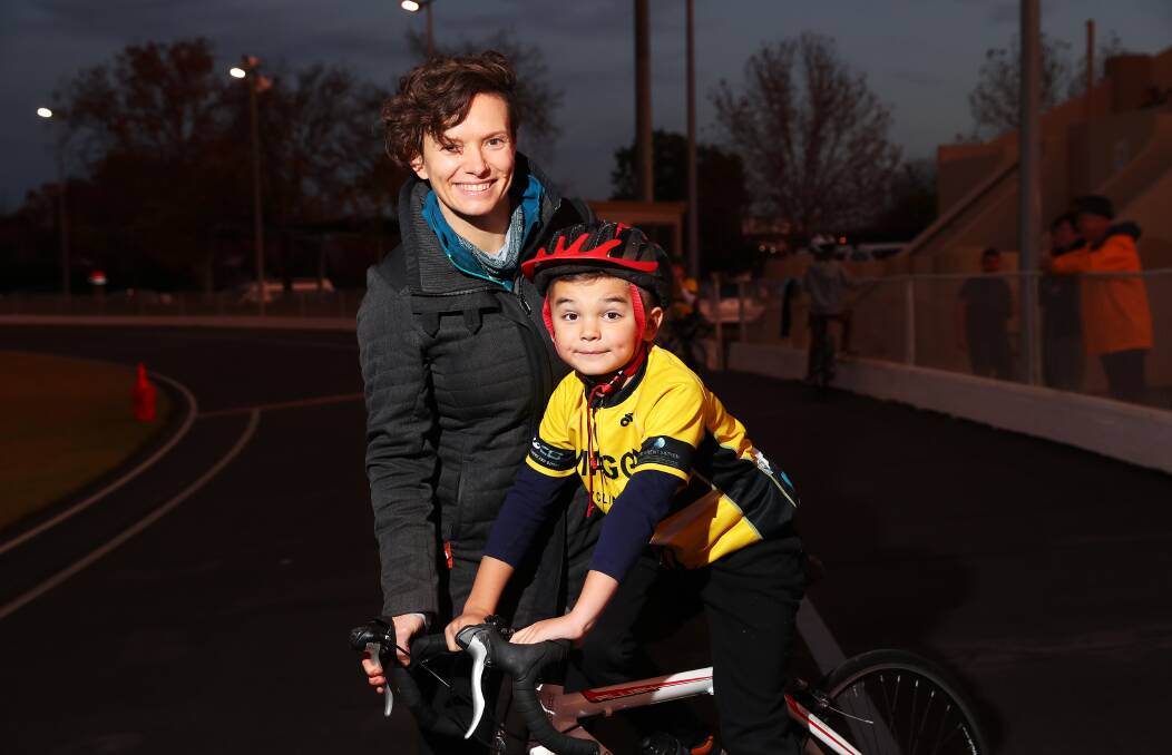 HELPING HAND: Former national criterium champion Sophie Uden (nee Mackay) with Samson Curry, 6, at Wagga Cycling Club training on Monday. Picture: Emma Hillier