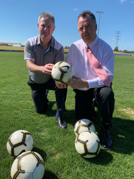 BIG TIME: Football Wagga president Tony Dobbin and Wagga Council deputy mayor Dallas Tout at Thursday's announcement that a W-League pre-season match will be played in the city in November. 