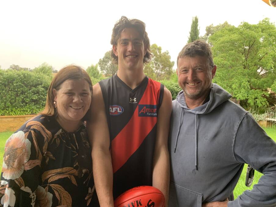 BABY BOMBER: Turvey Park product Patrick Voss with parents Maryanne and Phil after he was picked up by Essendon in the rookie draft. Picture: Jon Tuxworth
