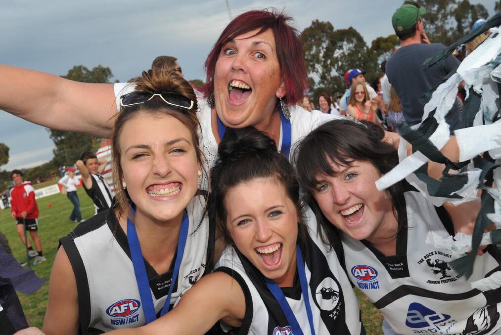 WINNING WAYS: Emily O'Leary (left) and Nicky O'Leary (back) celebrate TRYC's 2011 grand final win. Picture: Les Smith.