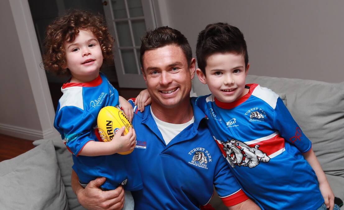 BACK IN KENNEL: Truman Carroll, pictured with sons Knox, 5 and Duke, 2, has returned to Turvey Park. Picture: Les Smith