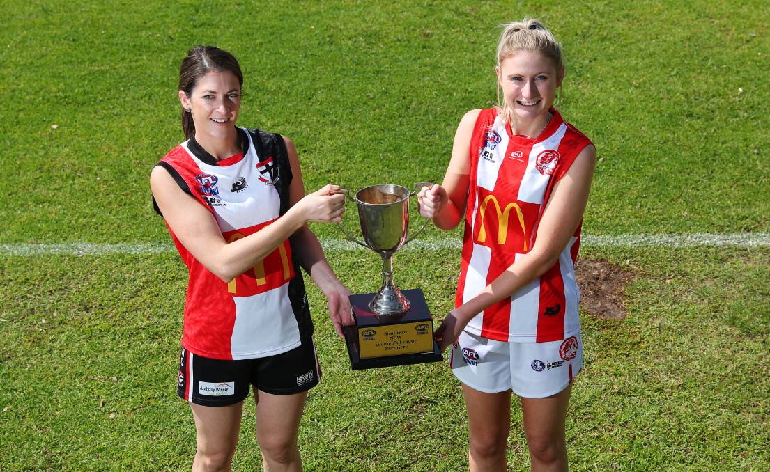 CRUNCH TIME: North Wagga Saints' Sarah Harmer and CSU captain Georgia Bradbury with the premiership cup before Thursday's AFL Southern Women's grand final at Apex Park. Picture: Emma Hillier