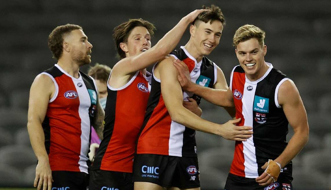 PROMISING START: Cooper Sharman (third from left) is congratulated by St Kilda teammates after kicking a goal late last season. Picture: Getty Images