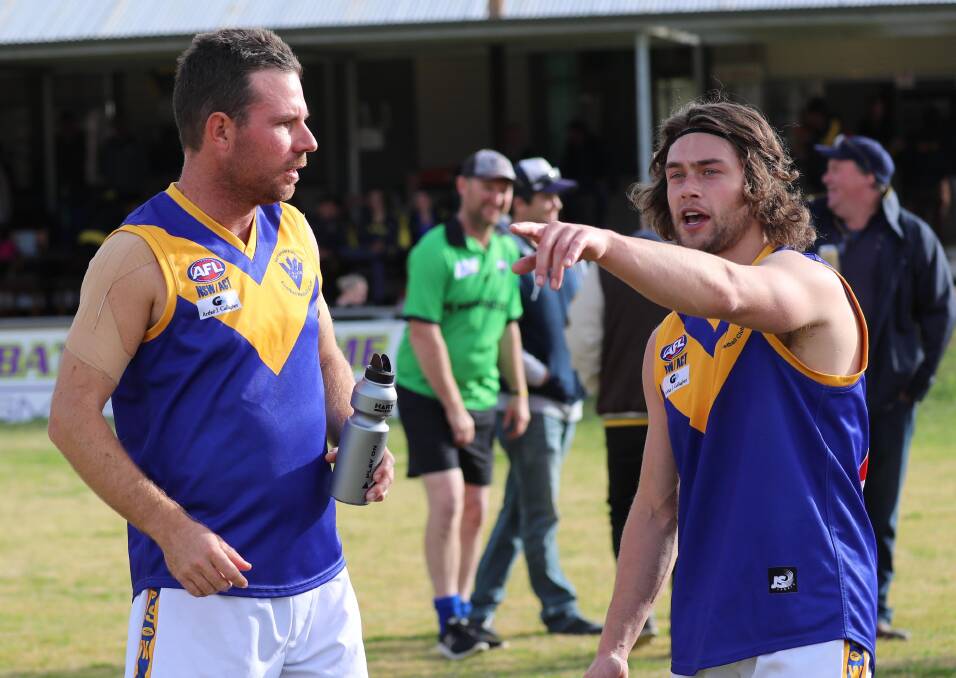 FOOTY IS BACK: Narrandera's James Sullivan and Blake Renet talk tactics during a clash with Mangoplah-Cookardinia United-Eastlakes in 2019. Picture: Les Smith