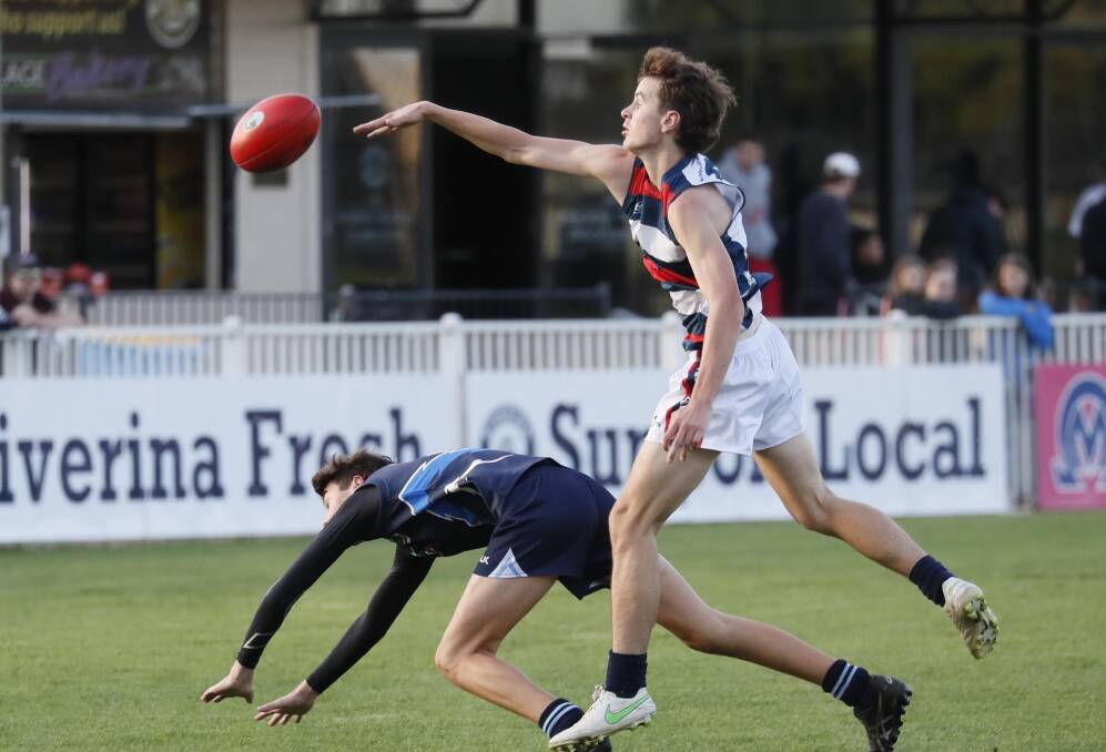 SHOWDOWN: Kildare Catholic College's Baxter Harmer gets a touch during last week's win over Wagga High. Picture: Les Smith