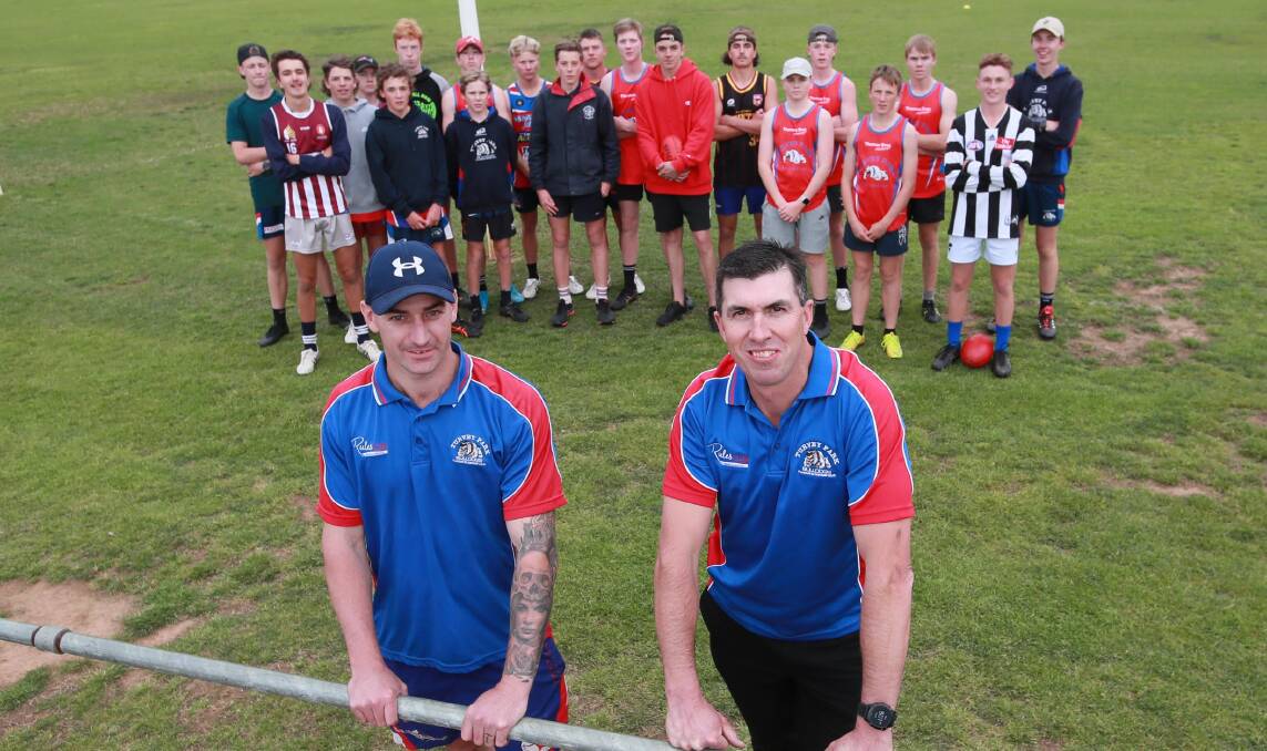 NEW ERA: Incoming Turvey Park coach Michael Mazzocchi (right), and this year's co-coach Josh Ashcroft with the Bulldogs' under-15s on Thursday. Picture: Les Smith