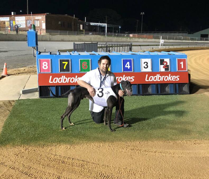 WINNER: Trainer Arron Gould with Winsome Logan after his upset win at Wagga's greyhound meeting on Sunday. Picture: Wagga and District Greyhound Racing Club