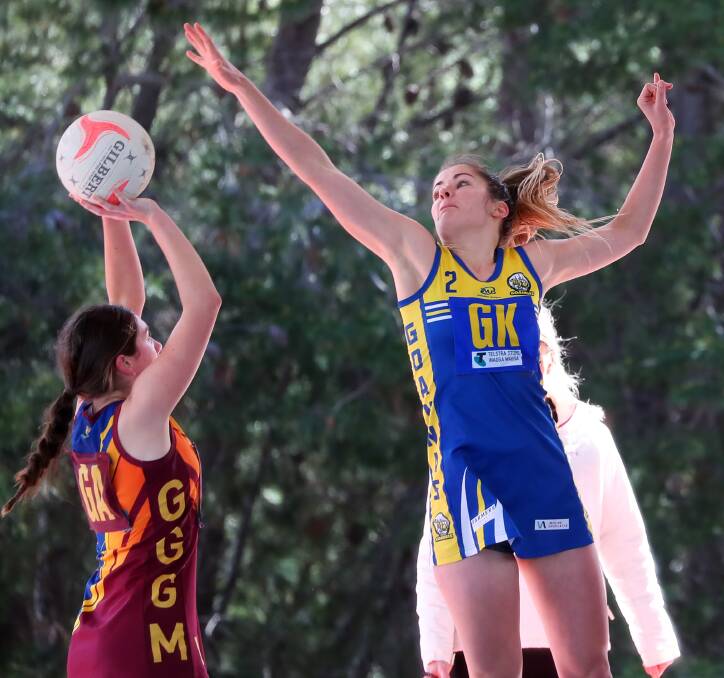 TALL ORDER: Ganmain-Grong Grong-Matong's Paige Kenny looks to get a shot over Mangoplah-Cookardinia United-Eastlakes defender Shannan Russell on Saturday. Picture: Emma Hillier
