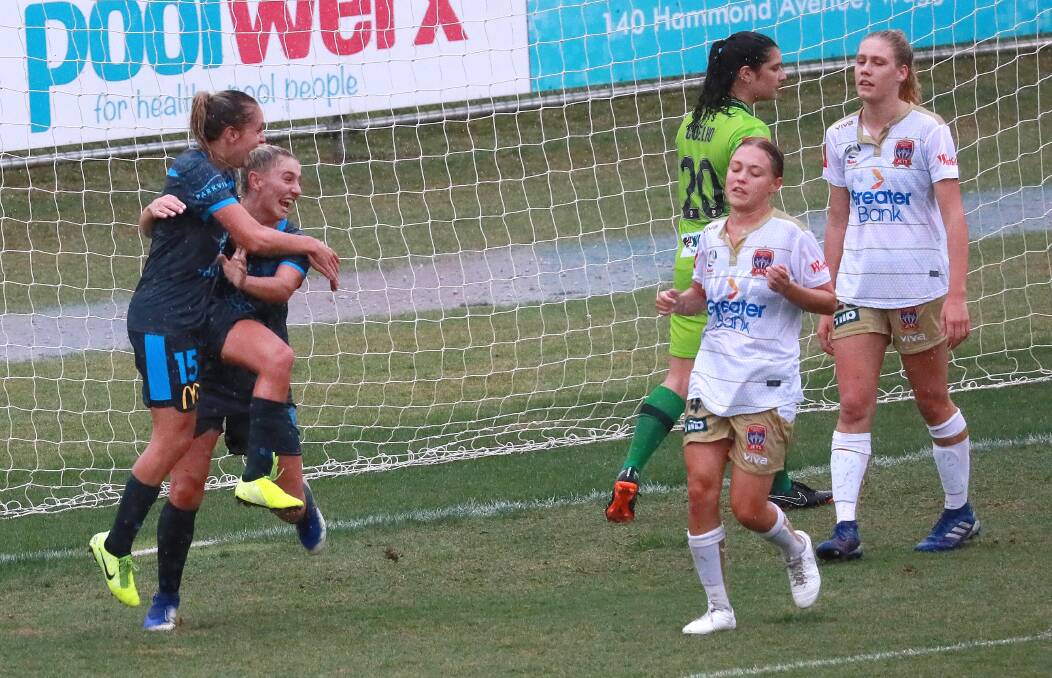 DOUBLE DOSE: Sydney FC's Mackenzie Hawkesby celebrates with teammate Remy Siemsen are scoring one of her two goals during a 2-1 trial win against Newcastle on Sunday. Pictures: Les Smith