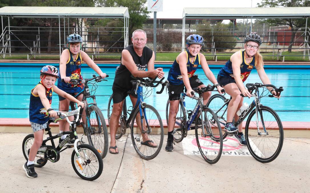READY TO RACE: Seth Harris, six, Brock Harris, ten, Bruce Tenhave, Nate Hamblin, 12 and Lily Tenhave are gearing up for the Ganmain Triathlon. Picture: Les Smith